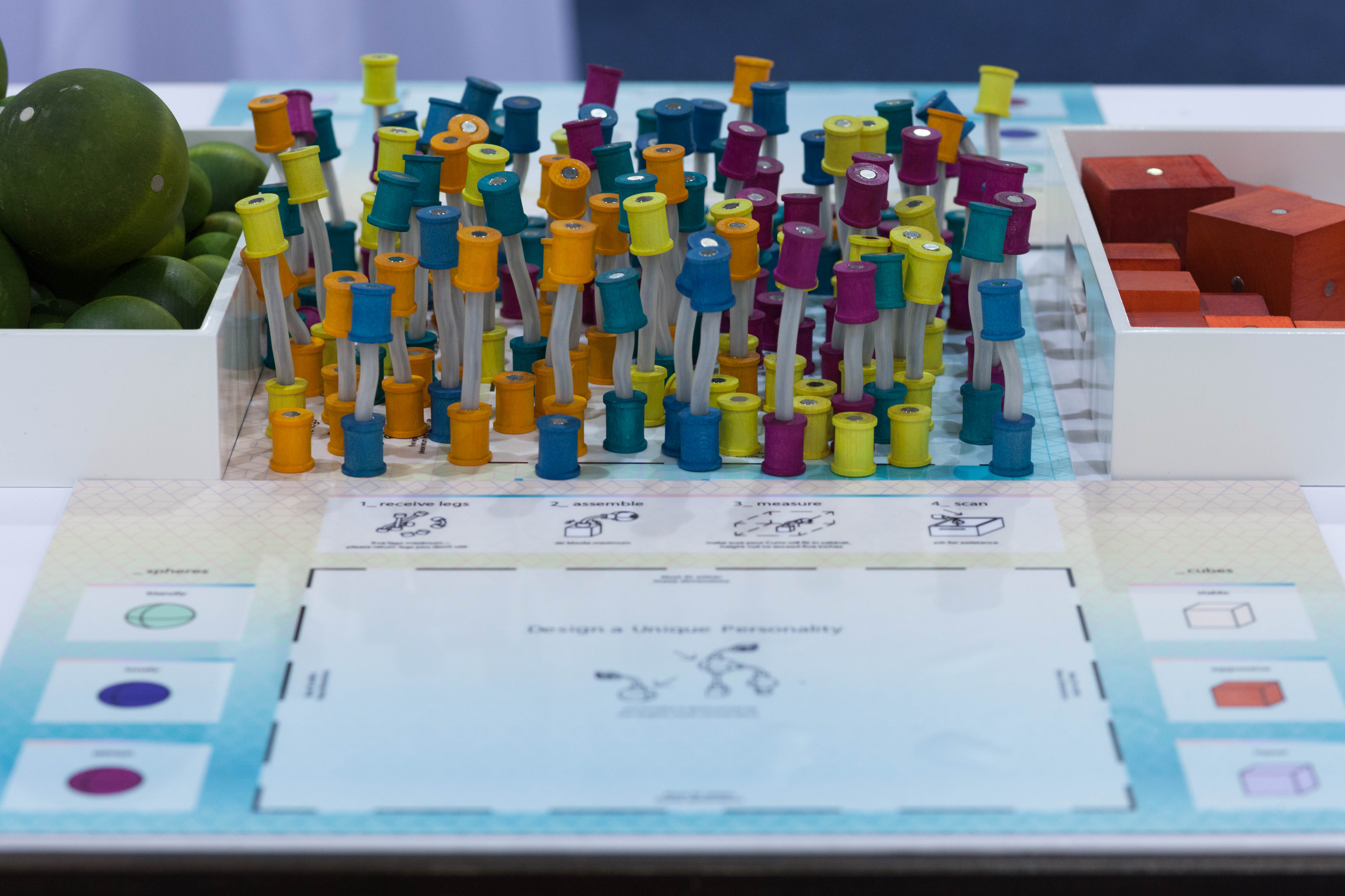 Illustrated placemats describe the properties, attitudes, and characteristics assigned to the Curio Aquarium's colored shapes.