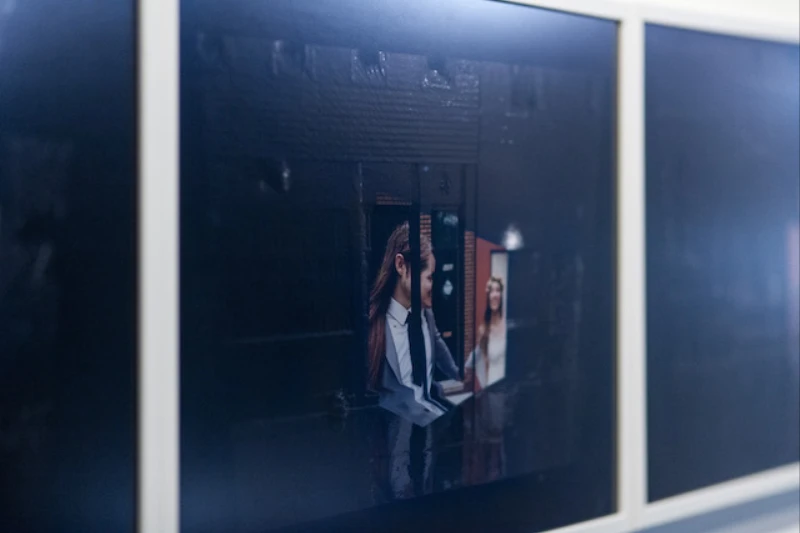 Close installation view of the wedding photograph work from Architectural Features in its white frame.