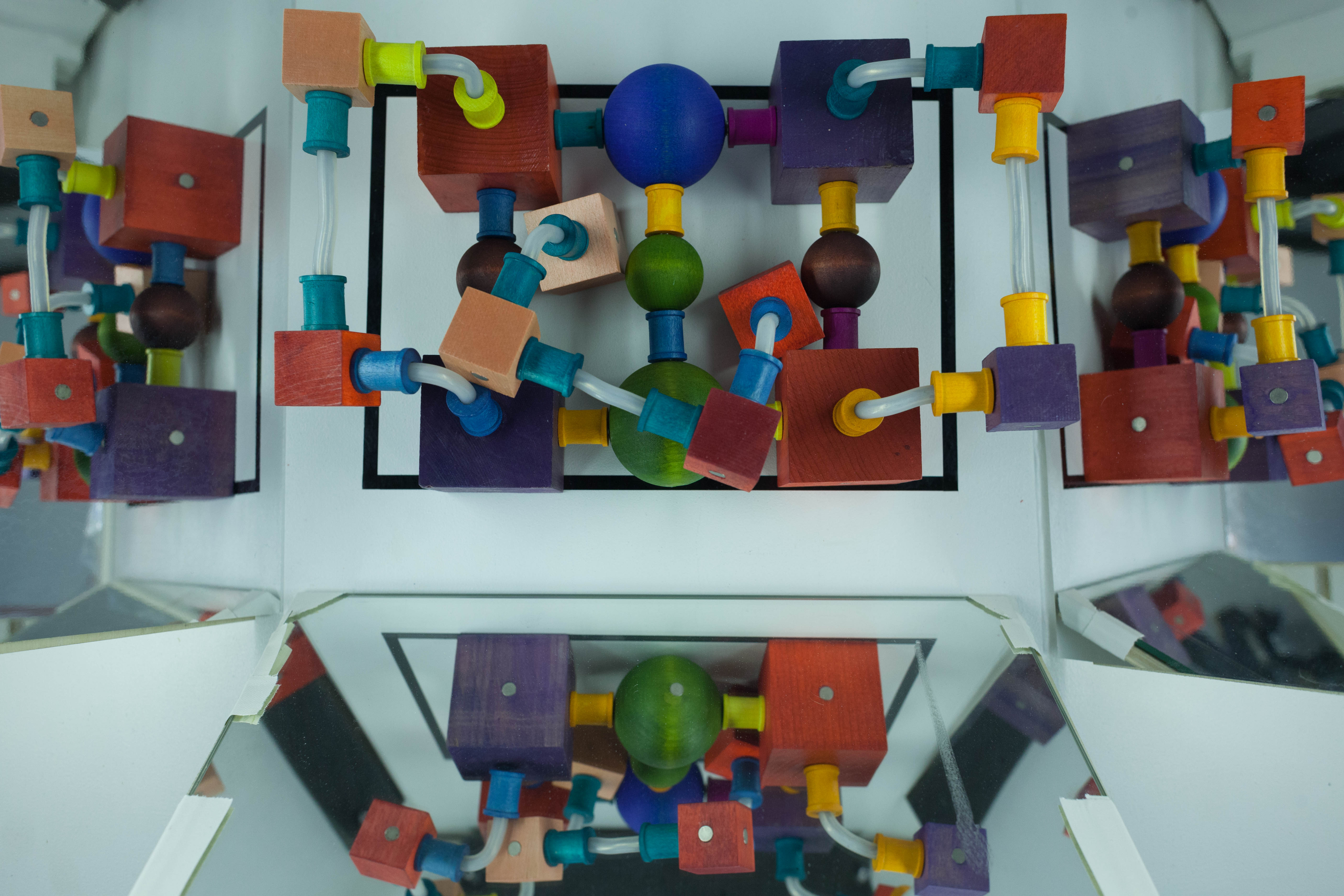 A completed Curio is viewed from above inside a mirrored drawer.
