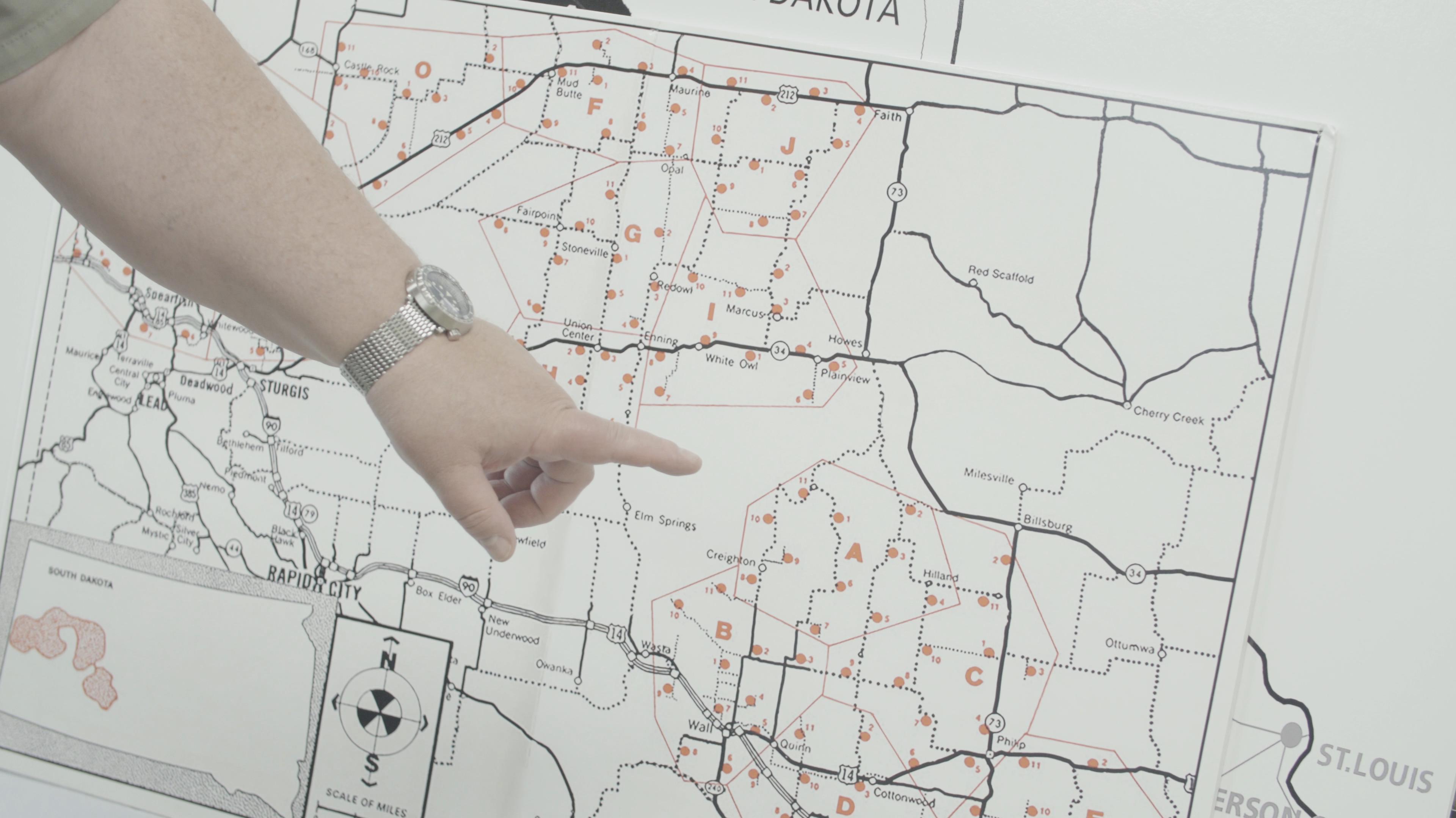 A guide points to a map of missile sites distributed across the northern Great Plains.