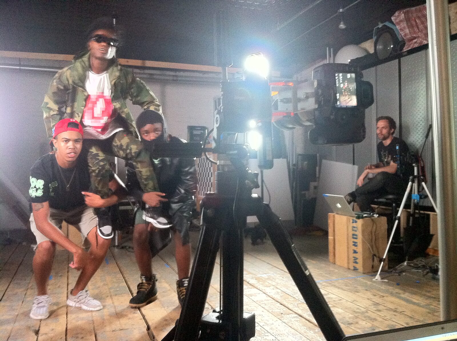 Three performers stand within the multi-camera capture setup for the Timberland × Stüssy interactive.