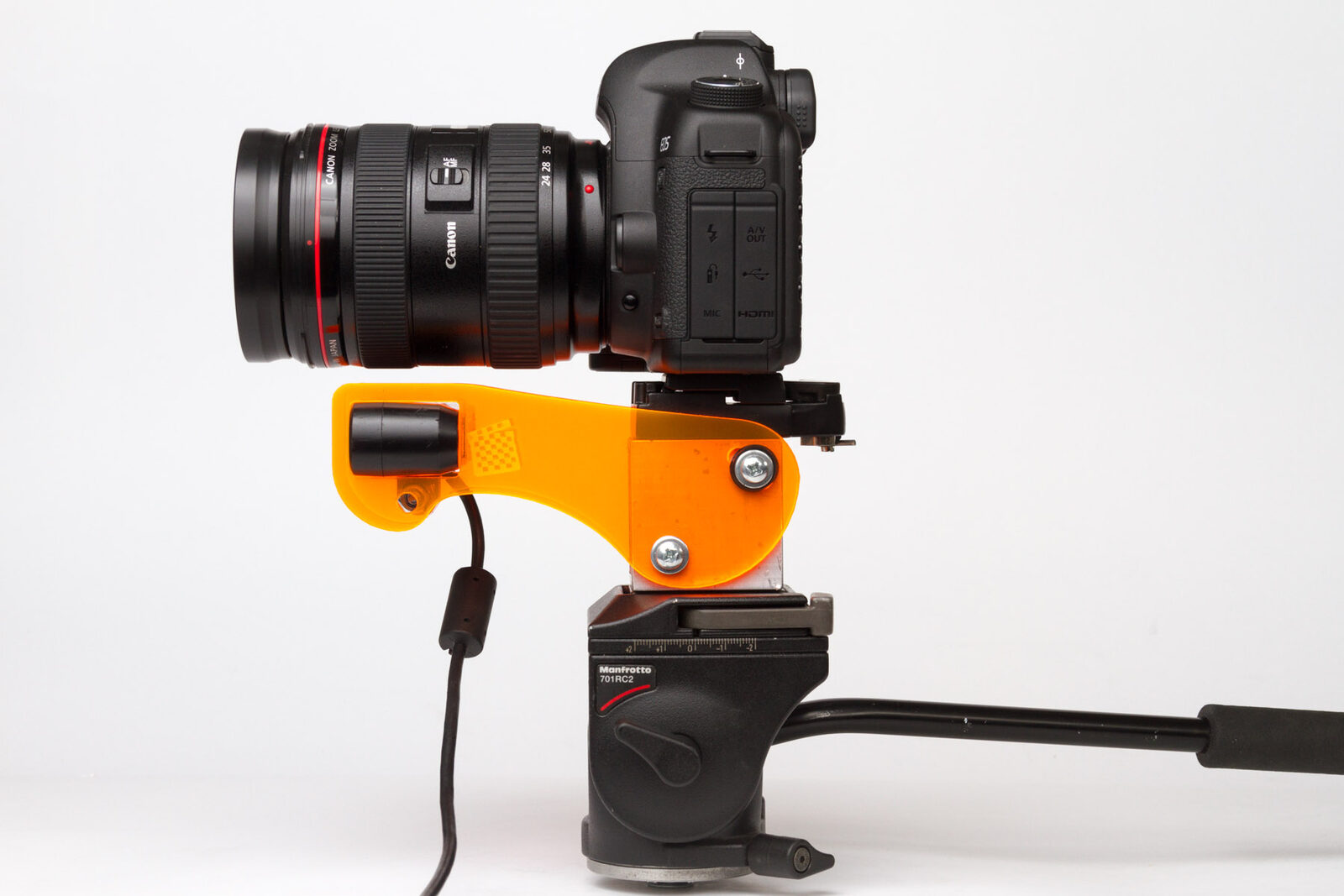 Side view of a DSLR and Asus depth sensor assembled on an orange acrylic Depthkit camera mount and tripod head.