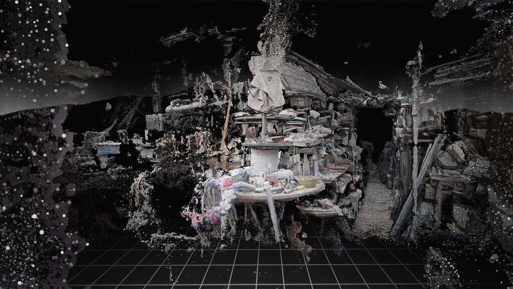 Purpose-made press image of George’s museum from the opening of Truth or Consequences, reconstructed as an incomplete point cloud with display cases and objects emerging from a black background.