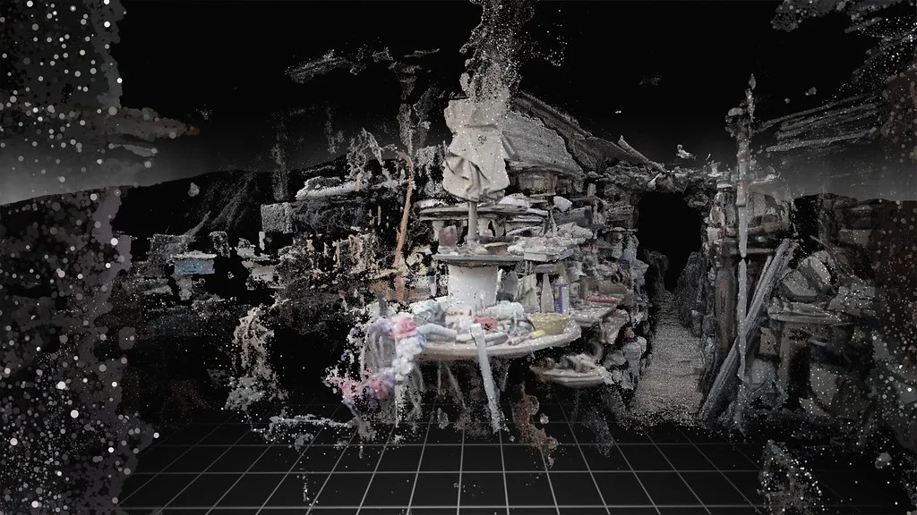Purpose-made press image of George’s museum from the opening of Truth or Consequences, reconstructed as an incomplete point cloud with display cases and objects emerging from a black background.